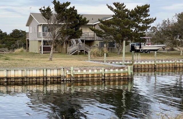 Canal Front Home with a Dock and Hot Tub minutes from the beach!