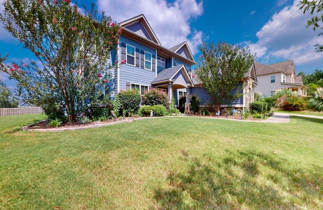 Champions Retreat | Dog-friendly home with fireplace, grill, and sunny patio