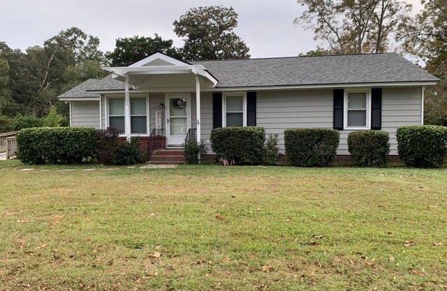 Charming house with a large fenced lot in a central location