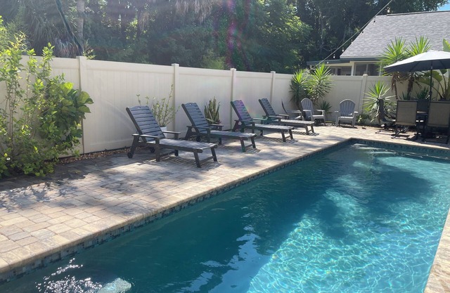 Close to beach! Family-sized home with pool and hot tub.