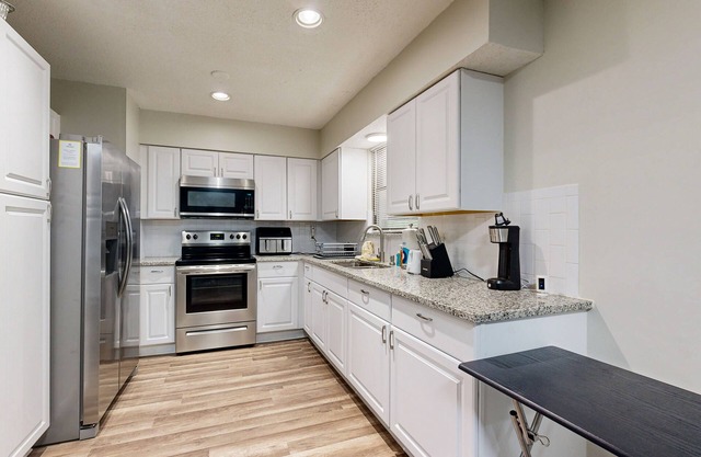 Cozy home with large patio, sun room, private W/D, central AC, and WiFi