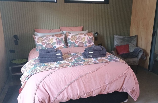 Cozy studio with trendy design, fully equipped kitchen, & modern bathroom.