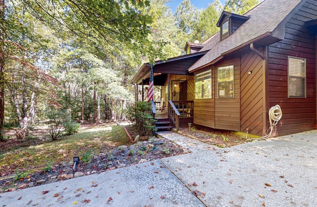 Delightful creekside cabin w/ spacious deck, private hot tub, fire pit, & views