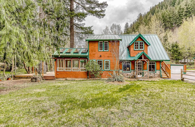 Dog-friendly creekside home with entertainment barn, private hot tub & firepit