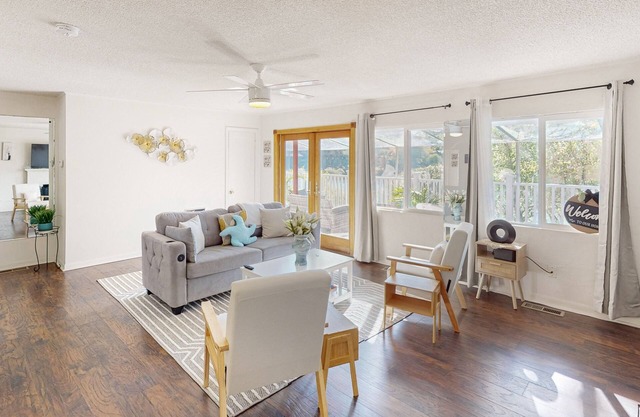 Dog-friendly lake view home with kitchen & kitchenette, patio, sunroom