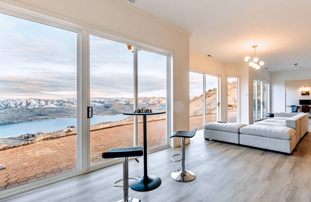 Dog-friendly lake view modern home with hot tub, workstations, & AC