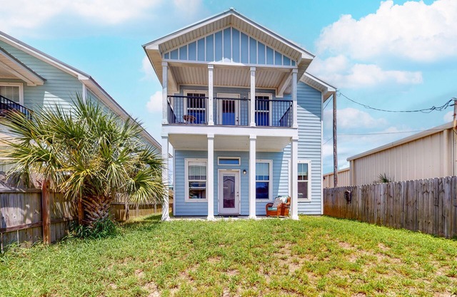 Dog-friendly beach house with balcony, fenced yard, & AC - walk to beach