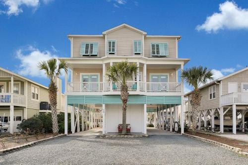 Doin` Time Canal Front home with elevator and extra living room