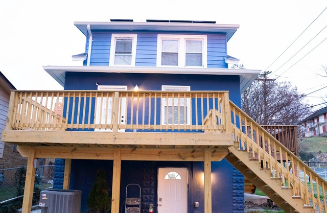 Entire two kitchen home including basement studio w/ parking, deck, and yard.