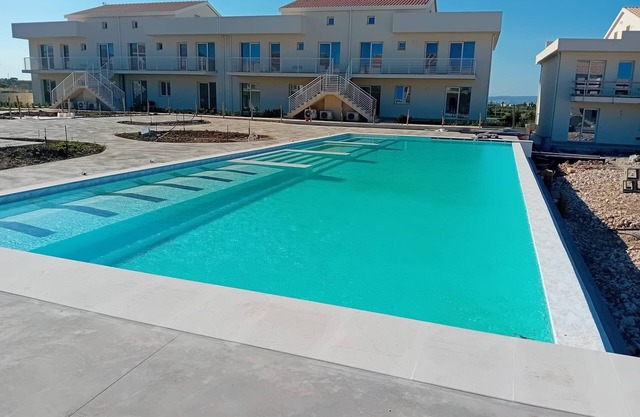 Exclusive New apartment with pool, private parking, close to the beach