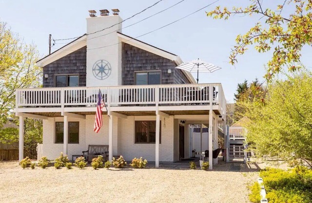 Experience quaint seaside living in this charming Montauk home with a Lux...