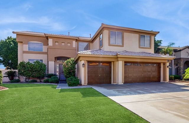 Exquisite home with firepit, game room, heated pool, pool spa, & putting green