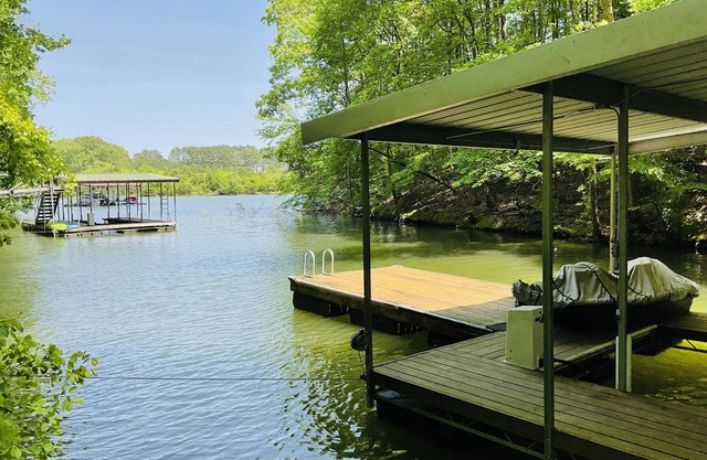 Family friendly lake front home with private dock in a cove