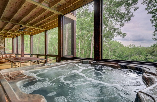Fantastic lodge near town with screened deck, hot tub, game room & WiFi