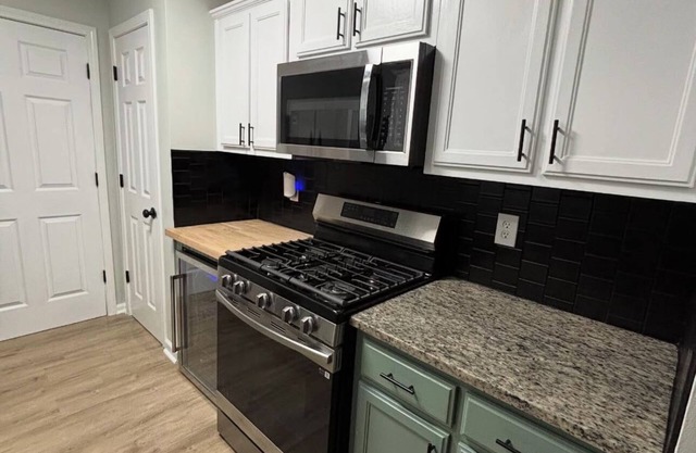 Fully Furnished Modern Home Patio with BBQ Grill for Relaxed Outdoor Living