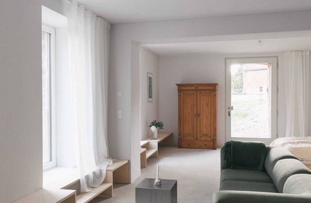GARDEN FLOOR LEFT: Open-plan living room, terrace and view of the countryside