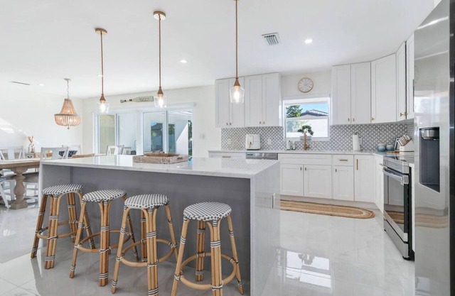 Gorgeous Waterfront Luxe Home w/ Heated Pool. Perfect Location!