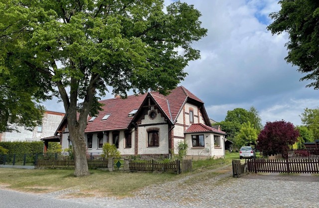 Historic house under lime trees with natural garden. Family-friendly.