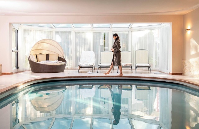 Apartamento vacacional "Alpenhof Lodge Hirzer" con vistas a la montaña, piscina comunitaria y Wi-Fi