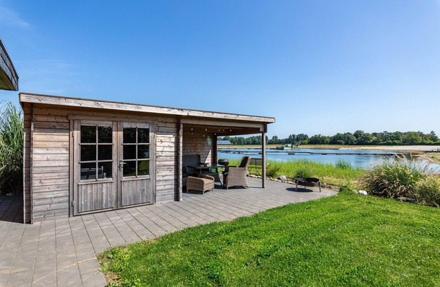 Casa de vacaciones 'Ferienhaus Am See' con vistas al lago, terraza privada y Wi-Fi