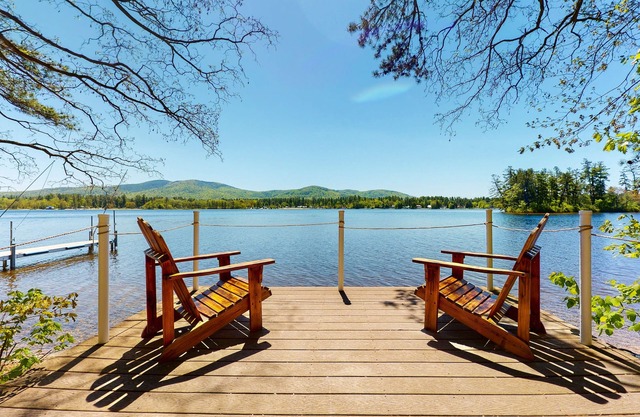 Homey lakeside property w/ one house, two cottages, mtn. views, & private beach