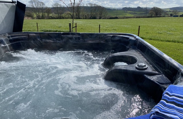 This bespoke handmade shepherd's hut, has a stylish modern interior which includes a well-equipped k