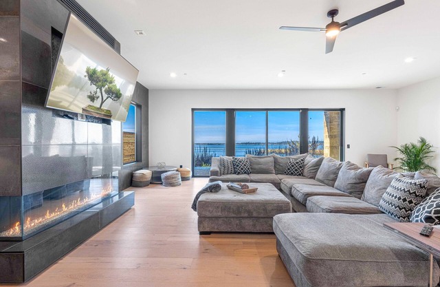 Impressive home w/ water view, 2 large decks, 2 living rooms & 2 master ensuites