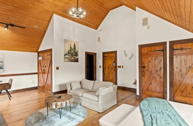 King Suite w/ Skylights | Sofa Lounge | Balcony + Trees