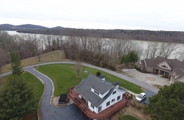 Lake house with boat ramp access across the street & tons of boat parking space.