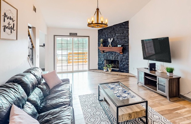 Lakefront home with home theater, game room, dock, & fenced yard - dog-friendly