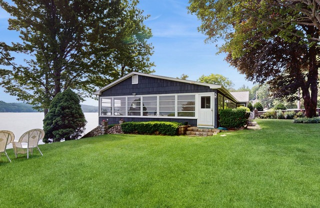 Lakeside paradise w/ lakefront deck, enclosed porch, 2 docks & large lawn