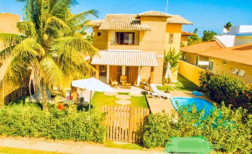 Linda casa de praia com piscina e 5 suítes - Ideal para famílias - Hibiscus - Condomínio beira mar