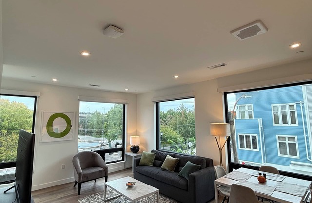 Luxury 1BR w/Rooftop 5 min to Logan Airport Free EV Garage Parking