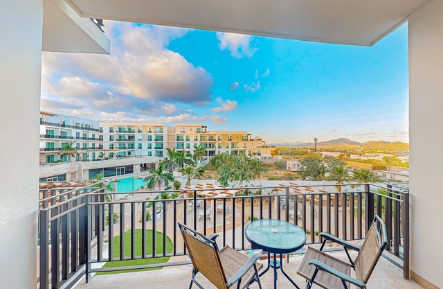 Luxury dog-friendly condo with mountain views, on-site pool, gym, balcony, & W/D