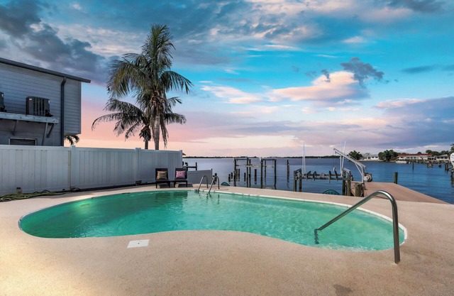 Luxury Waterfront Farmhouse Retreat w/ Saltwater Pool, Dock & Tiki Bar