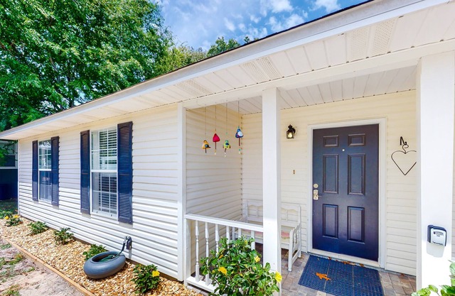 Modern dog-friendly home near the Gulf with yard, grill, screened porch & bikes