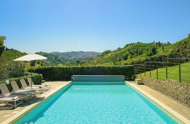 Modern villa with private pool and panoramic vineyard views in Piemonte.