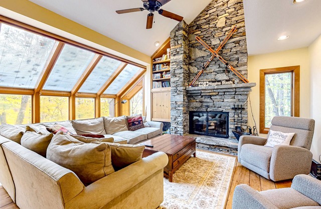 Mountain-view home with private hot tub, sauna, on-site lake access, & fireplace