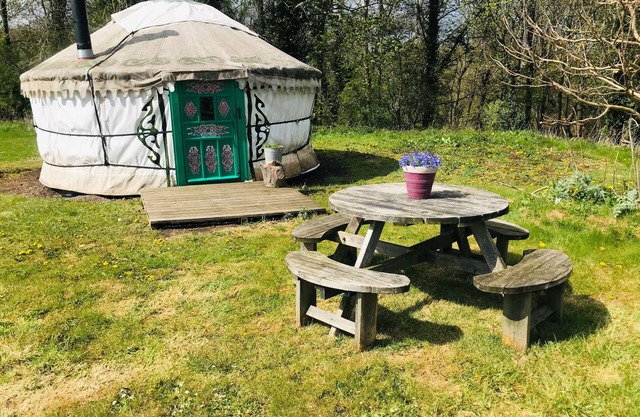Myrtle, a cosy Mongolian yurt, nestled in field and woodland surroundings