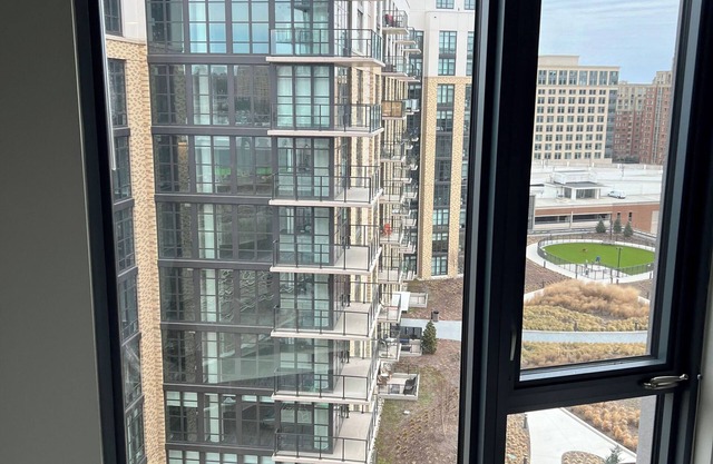 NEW building with gym and rooftop. Walk to movies and restaurants.