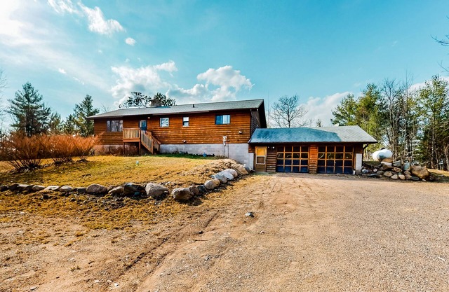 Quiet lakefront home with dock, canoe, & sunroom - dog-friendly