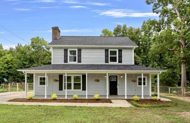 Red Lantern Farmhouse with Tesla Charger!