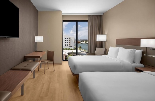 Relax in 4 Elegant Rooms with Rooftop Pool and Poolside Umbrellas