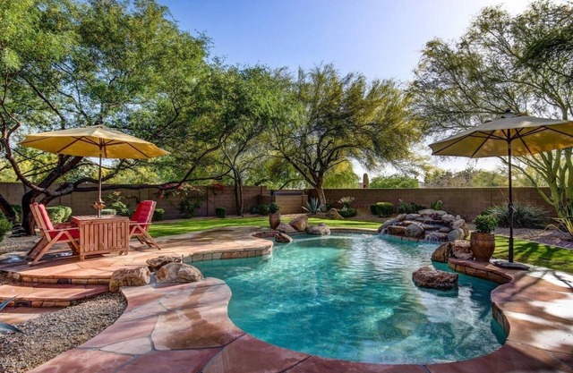 Resort like backyard w/ Heated pool. Home Theater