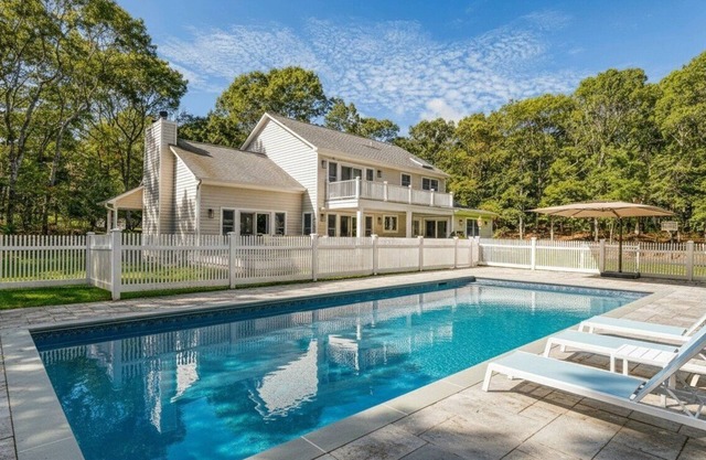 Resort-style Southampton retreat with heated pool, chic interiors, and.
