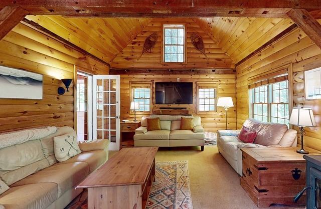 Roomy farmhouse with private hot tub, firepit, pool table, sunroom, & woodstove