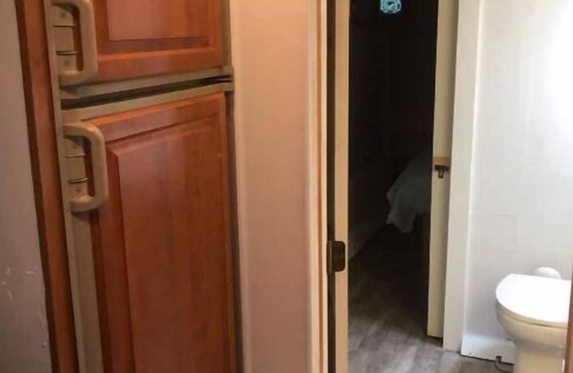 RV w/master bedroom, full bath & kitchen.