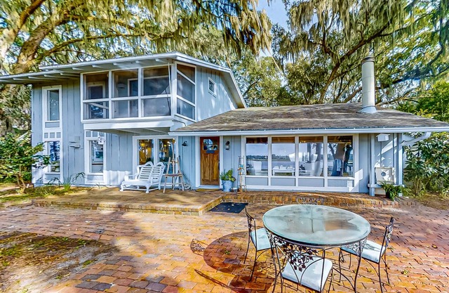 Secluded riverfront home with dock, firepit, grill, river views, patio, & AC