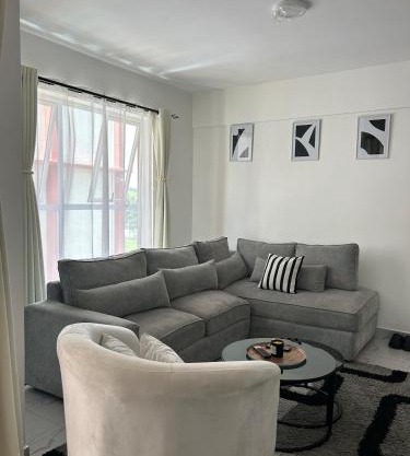 Secret Serenity - Modern, Stylish & Comfy 2 Bedroom Apartment With Workspace, Secure Parking, CCTV, Swimming Pool, Gym, And City Views in Nairobi