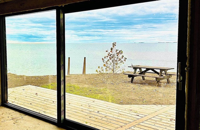 Serene Lake Ontario cottage, overlooks (kayak to) sandbank beach. Private oasis.